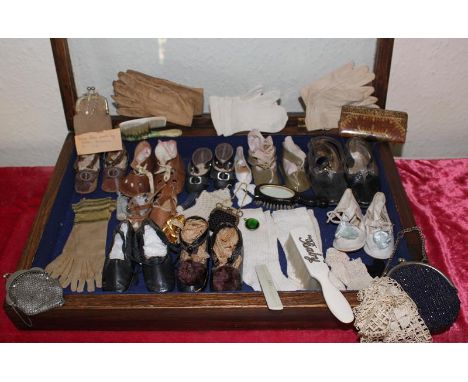 A good collection of Antique and Vintage dolls and baby shoes, dolls and babies gloves, numerous dolls and miniature metal an
