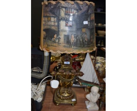 A well cast ceramic lamp base of a rampant lion having gilt effect finish