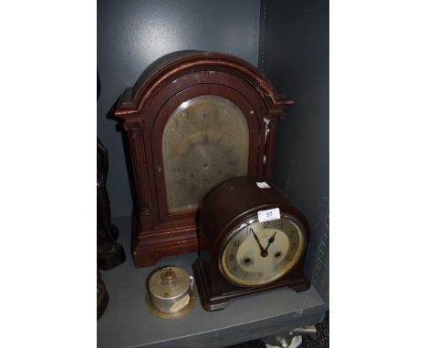 An early plastic Enfield chiming mantel clock and similar wooden cased mantel clock with bevelled glass door.