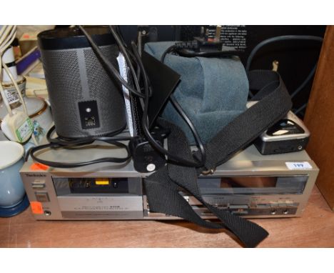 A selection of audio devices including Sonos speaker with booklet walkman and Technics tape deck also included is a Canon AV-