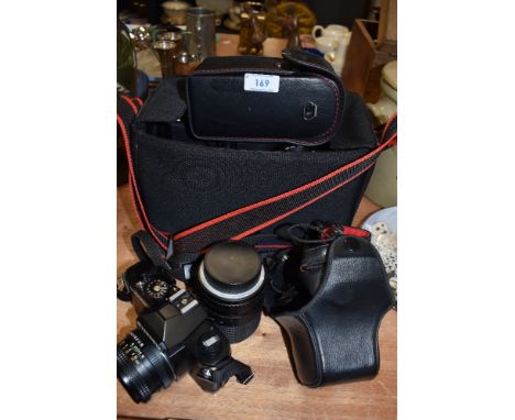 A Vivitar XV2 35mm camera with Vivitar 50mm and 135mm lens and a Chinon Cm-4s 35mm camera with Chinon 50mm and Mirage Mk11 13