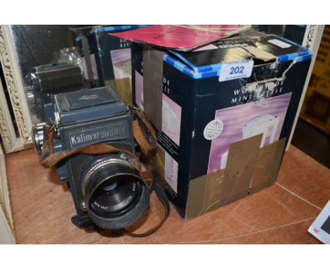 a Kalimar Six Sixty film camera
Kaligar 1:2:8 F 80mm