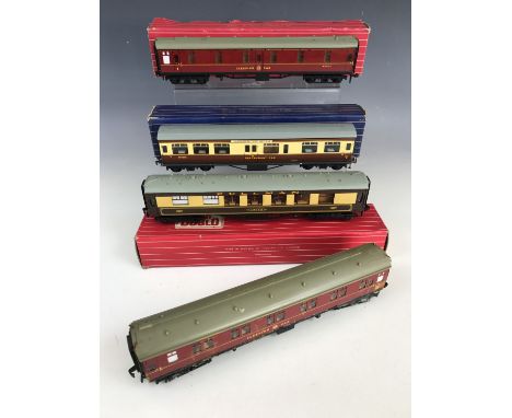 Three boxed Hornby Dublo electric OO gauge model railway carriages including a D20 composite restaurant car, a 4035 Pullman c