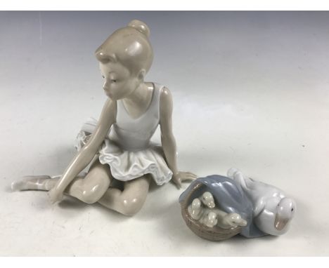 A Nao figurine of a ballet dancer together with a Lladro group of ducks