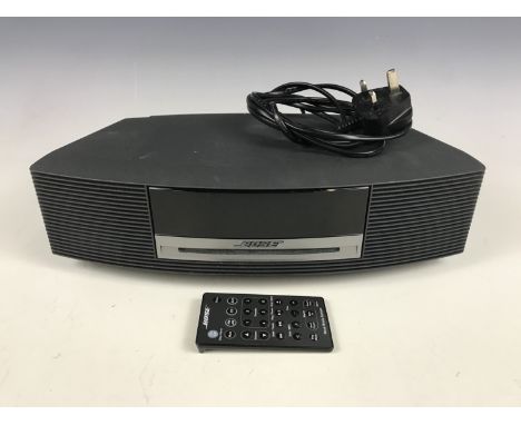 A Bose Wave music system with remote control, model AWRCC5
