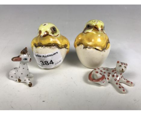 A pair of novelty cruets in the form of chicks, and two ceramic animals