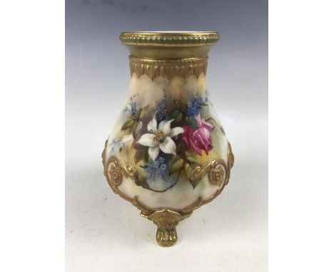 An early 20th Century Royal Worcester vase decorated by F.J. Bray, of baluster form with three claw feet, decorated with appl