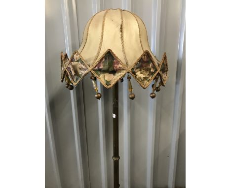 An early 20th Century brass telescopic standard lamp with period flamboyant shade