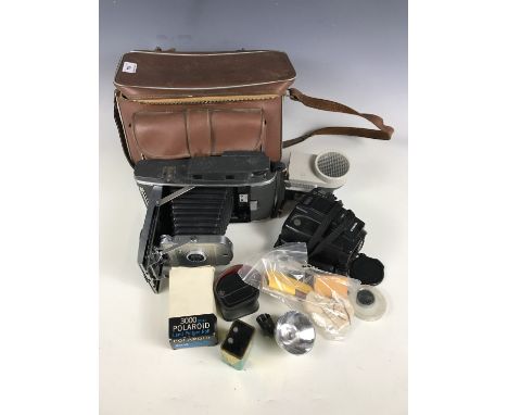 A Polaroid Model 160 land camera with accessories, together with a Chinon Genesis