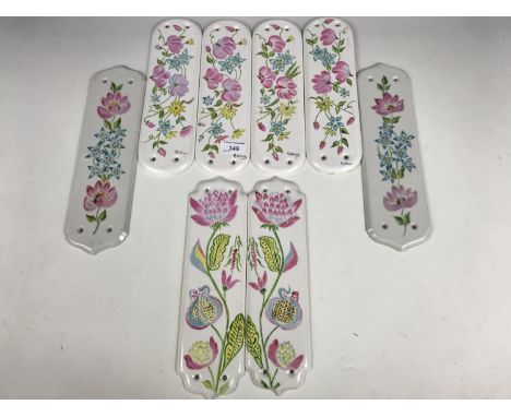 Eight hand decorated ceramic door finger plates