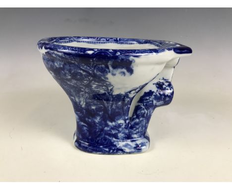 A reproduction blue-and-white miniature ceramic toilet 