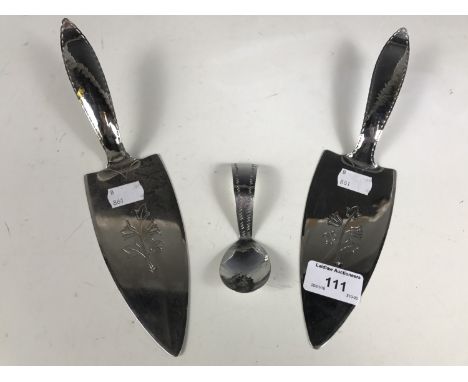 Two Keswick School of Industrial Arts cake knives together with a KSIA caddy spoon