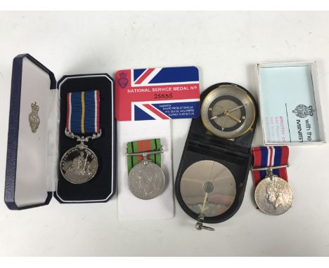 A National Service medal together with Second World War campaign medals and a compass