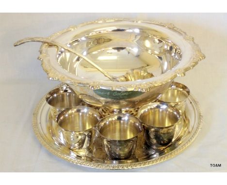 A silver plated punch bowl and ladle with a plated tray and 8 tumblers