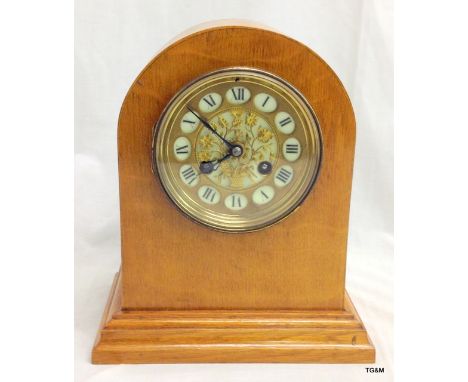 A French sterling mantle clock with gilt pierced fretwork dial 