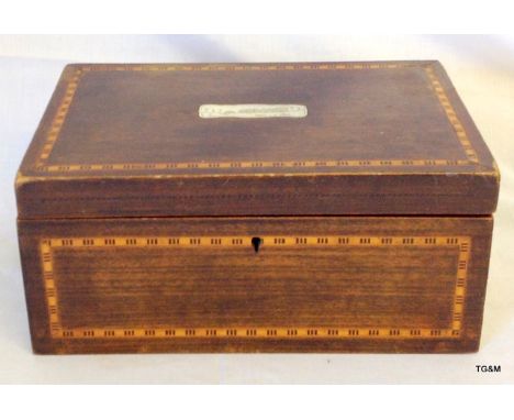 A Victorian mahogany inlaid jewellery box with mother of pearl carved inset