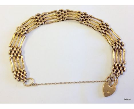 A ladies 9ct gold gate bracelet