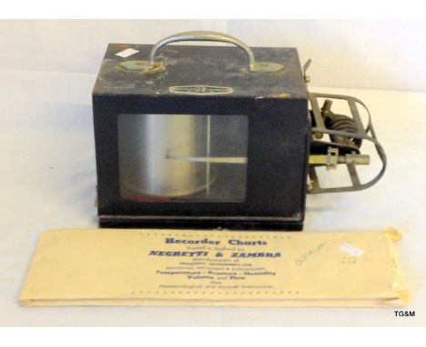 A Negretti and Zambra Barograph in black painted metal case with some recorder charts