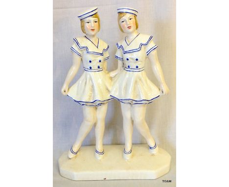 A ceramic Art Deco style figure of two sailor girls