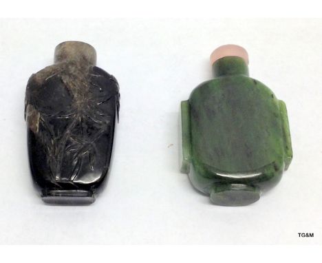 An antique Chinese carved rock crystal snuff bottle and a Nephrite Jade snuff bottle