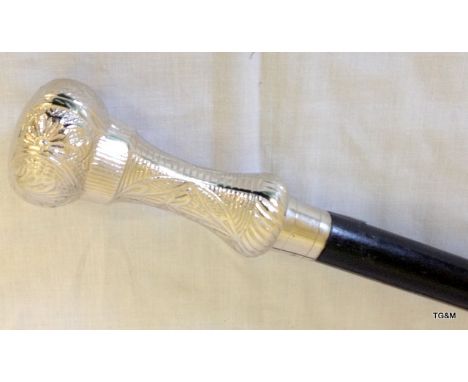 An ebonised walking stick with silver plated top