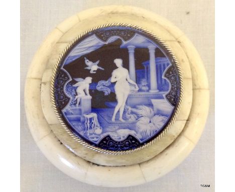 A bone trinket box with enamel lid depicting a classic scene