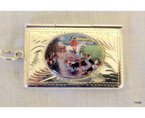 A silver stamp case with enamel set hunting scene