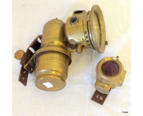 A vintage Lucas brass bike lamp and one other