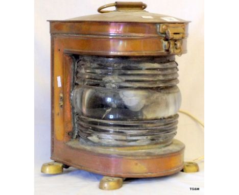 A vintage brass cased ships light converted to electric