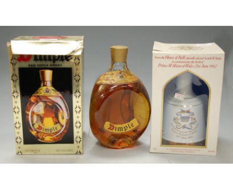 Dimple Haig scotch whisky, two bottles; and a Bell's celebration scotch whisky, in commemorative decanter, 50cl, 40%, in cart