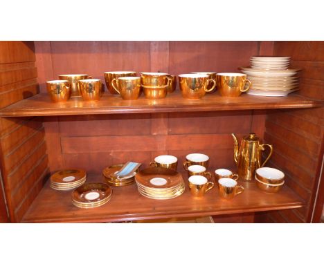 A Royal Worcester gilt porcelain part tea service, comprising teapot, tea cups, coffee cups, saucers, and side plates, togeth