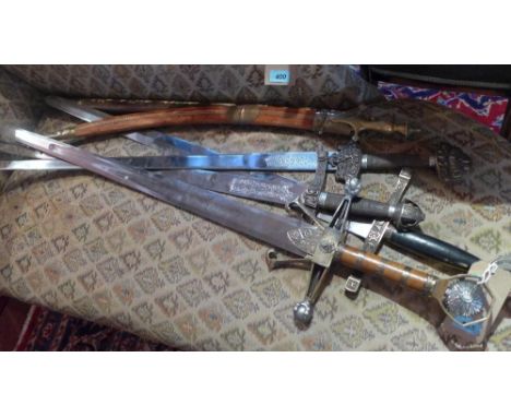 A collection of six decorative swords to include King Arthur's Excalibur, Robin Hood sword and a mother of pearl inlaid teak 