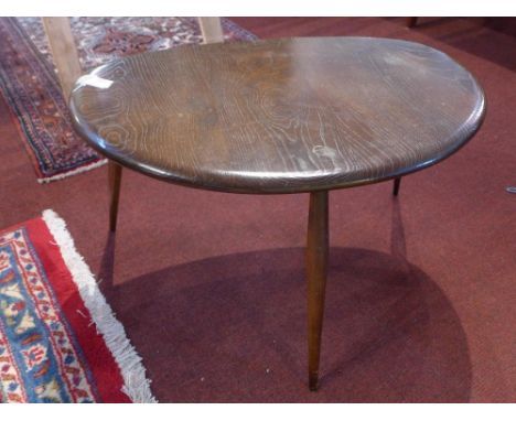 A mid 20th century Ercol pebble table 