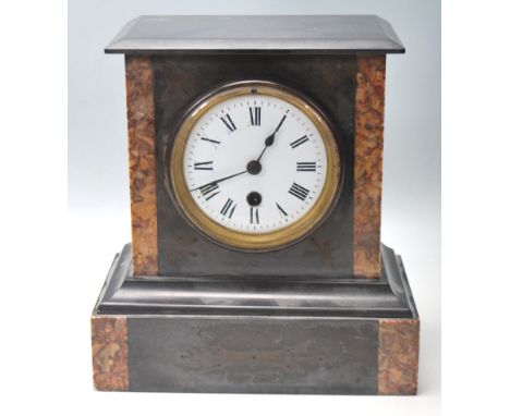 An Antique 20th Century Marble slate mantel clock having a flared top over a white enamel face and roman numeral chapter ring