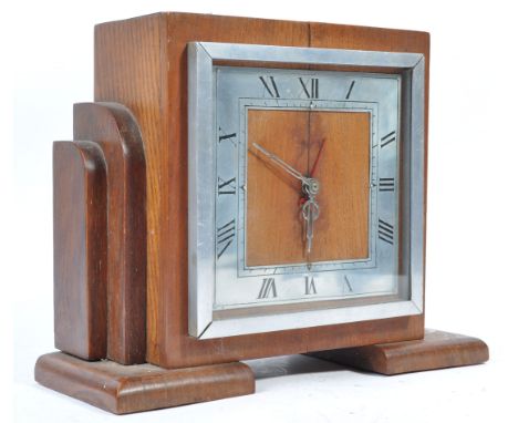 Sterling - A 1930's Art Deco oak cased Sterling of Croydon Electrical mantel clock. The Deco oak case with silvered chapter r