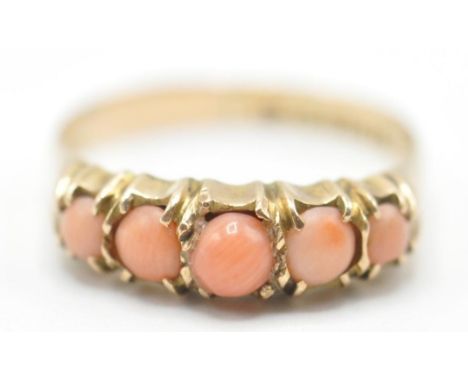 A 19th Century Victorian 9ct gold ring set with five angel skin coral cabochons in prong settings. Hallmarked Chester 1891. W