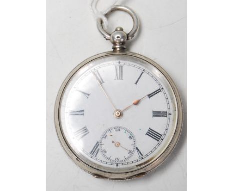 A 20th Century French continental silver pocket watch having engine turned decoration to the back with a central cartouche pa