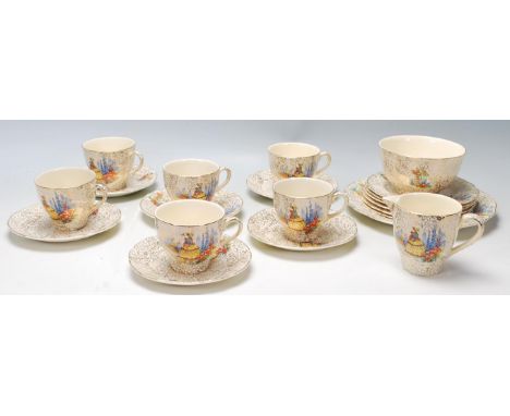 A vintage 1930s fine bone china 21 piece tea service in the Crinoline Lady pattern by J. Fryer &amp; Sons. The service, havin