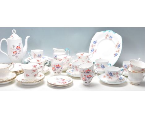 A selection of Royal Albert English bone china tea sets to include Rose Time pattern tea cups, Blue Bird pattern part service