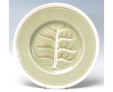 Art Deco Susie Cooper “ tree of life “ cabinet plate with green colour background white rim and tree of life designed to the 