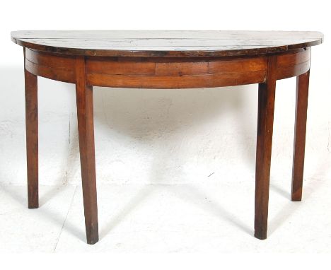 An early 19th century George III mahogany D end / demi-lune side console table having a rounded edge&nbsp; top over fitted fr