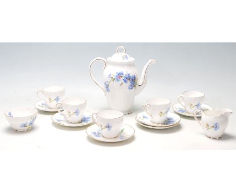 A vintage retro 20th Century Royal Adderley porcelain coffee service in the Cornflower pattern consisting of five tea cups an