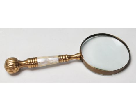 A 20th Century antique style magnifying glass having a brass and mother of pearl handle. 26cm long.