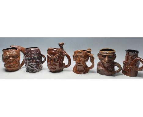 A group of six Australian Bendigo studio art ceramic pottery limited edition character mugs to include Don Bradman, Henry Law