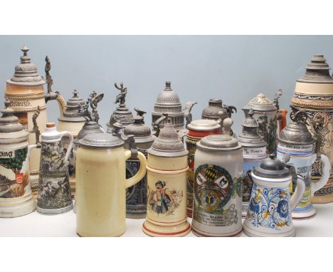 A collection of 20th Century German ceramic stein drinking glasses, each having raised polychrome decoration to the sides , m