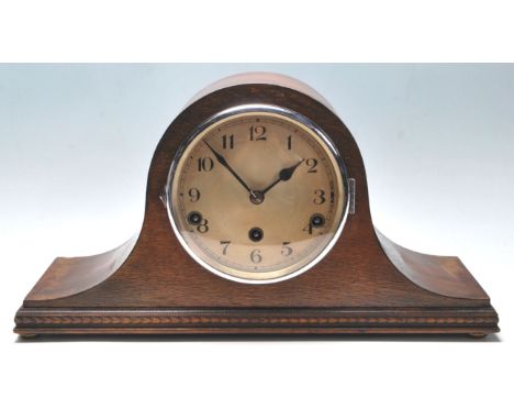 An mid century 1950's Napoleon's hat / dome top mantel clock with a 5 bell striking mechanism having a silvered face with ara