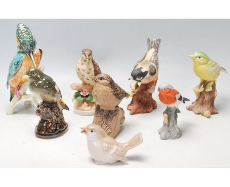 A collection of 20th Century ceramic birds to include Italian bisque examples, a Kingfisher figurine, and various other birds