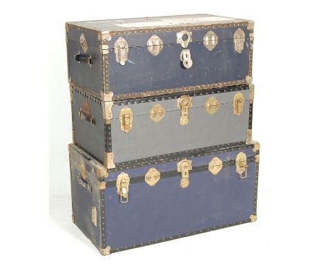 A collection of three vintage steamer / travel trunks dating from the first half of the 20th Century having brass corners and