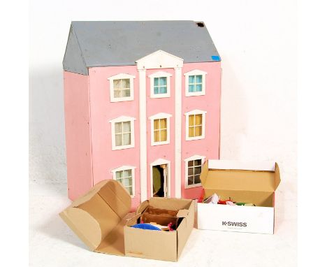 A vintage scratch built three storey toy dolls / doll's house. Each room fully appointed with various scale dolls house furni