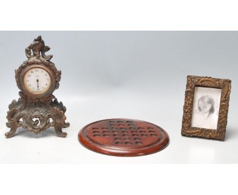 A collection of 20th century antique items to include a french cast iron mantel clock with windup movement and gilt decoratio